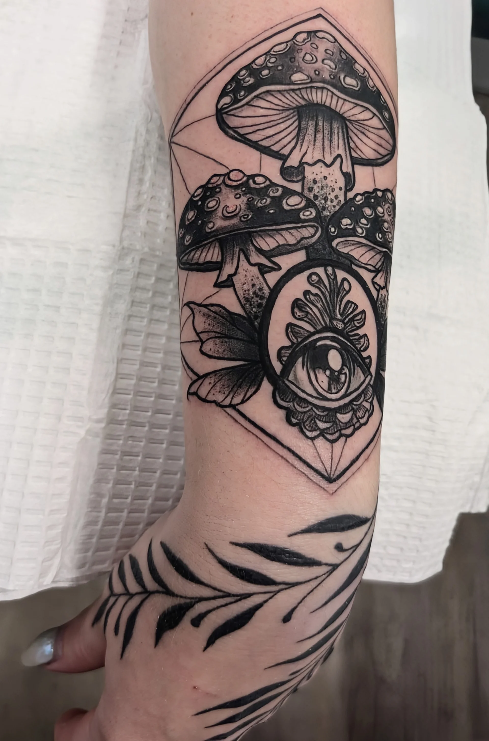 Mushroom Eye Foliage Detail - blackwork tattoo by Saskatoon tattoo artist