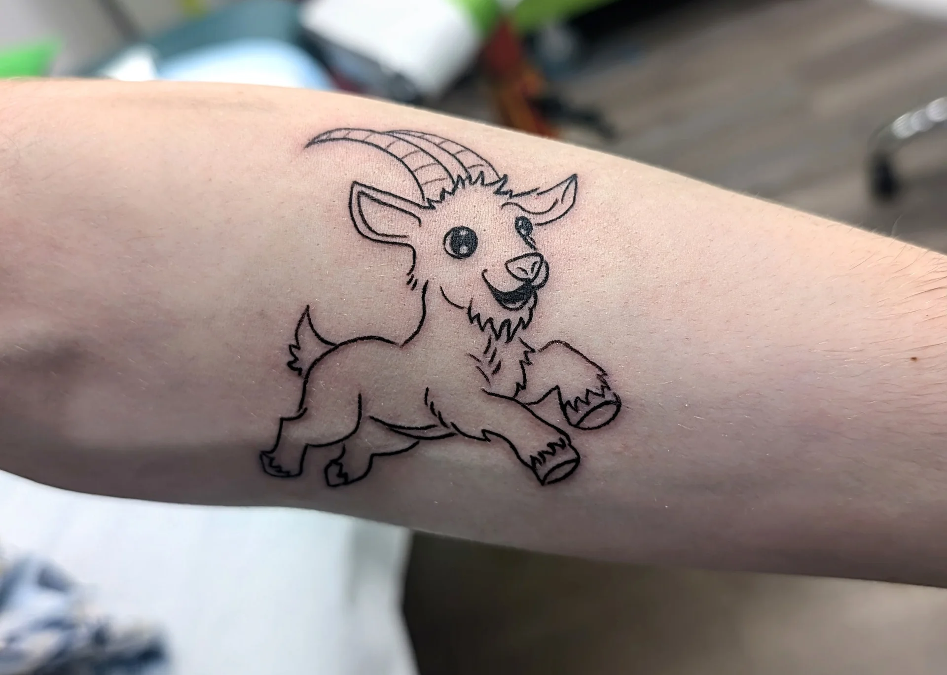 Frolicking Goat Ram - illustrative tattoo by Saskatoon tattoo artist