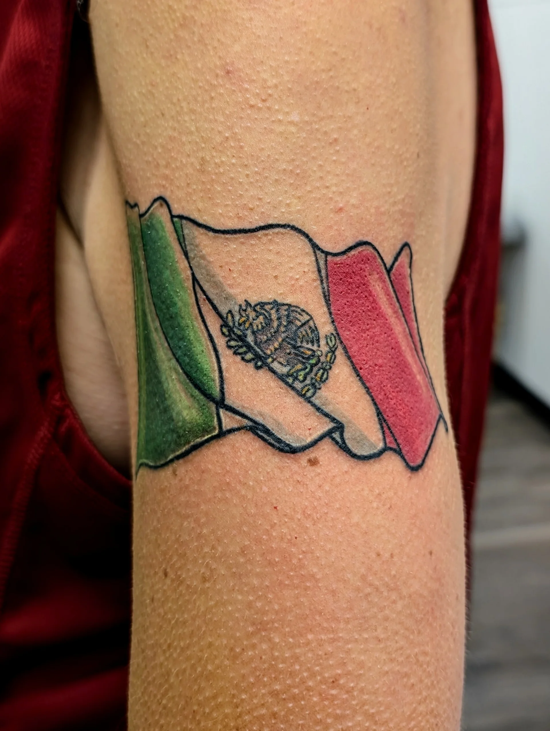 Italian Flag Waving - illustrative tattoo by Saskatoon tattoo artist