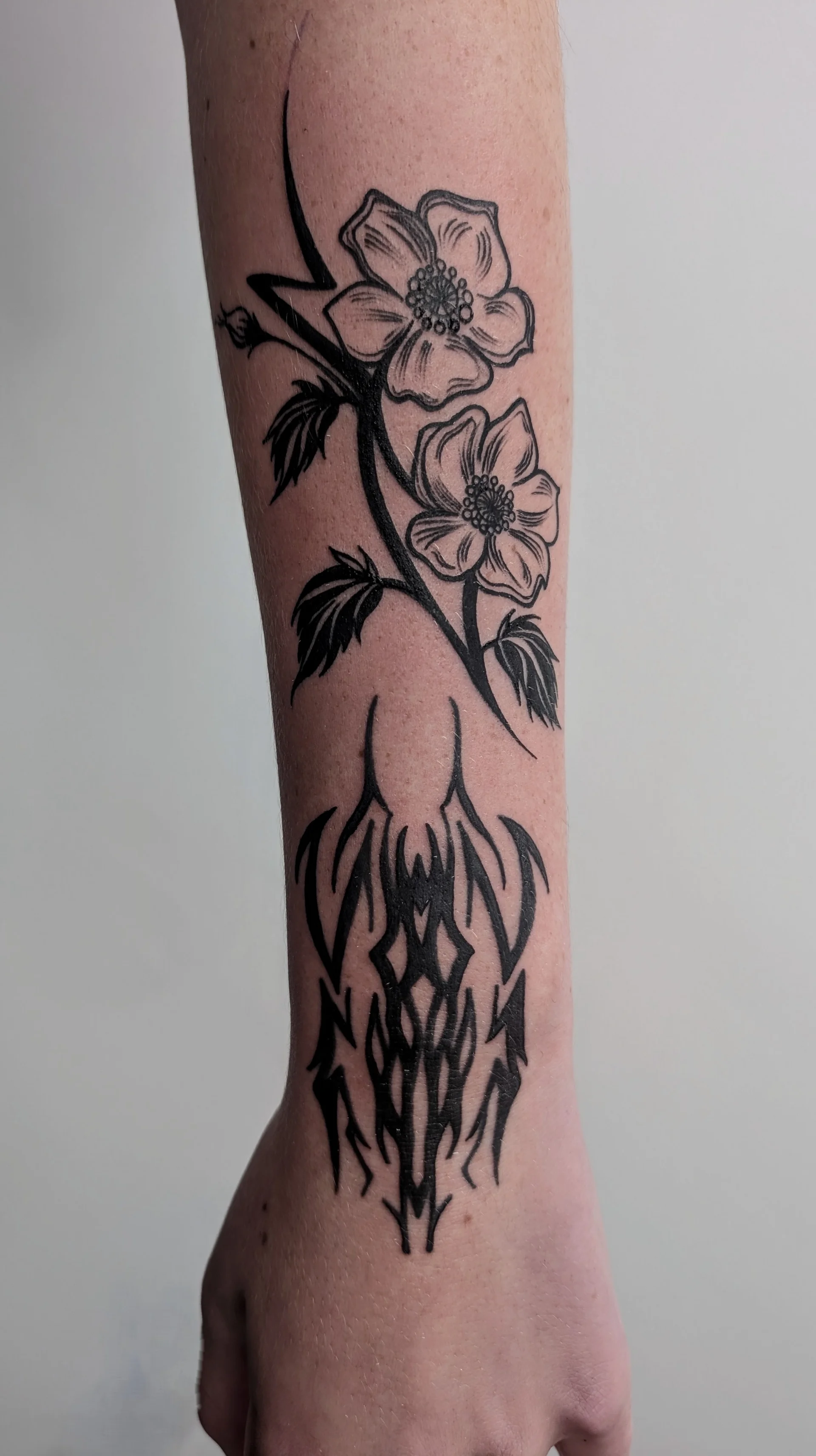 Lightning Flower Tribal Lines - illustrative tattoo by Saskatoon tattoo artist