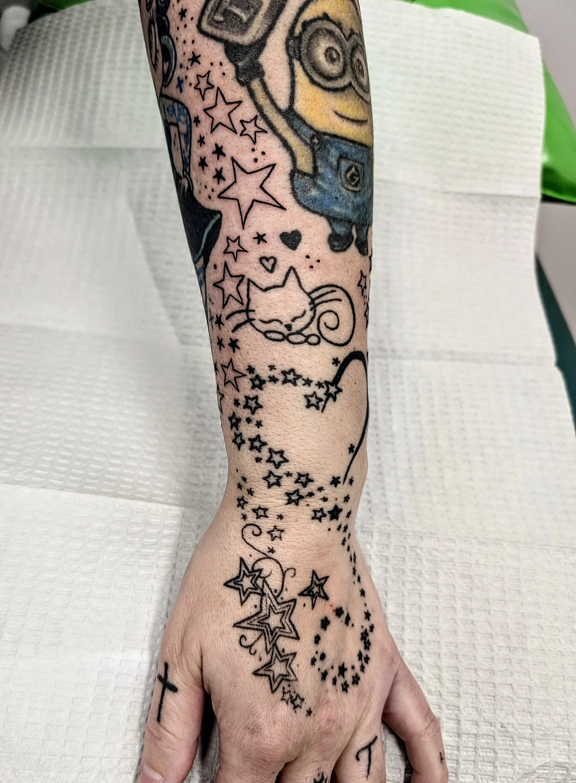 Star Filler Arm Hand - illustrative tattoo by Saskatoon tattoo artist