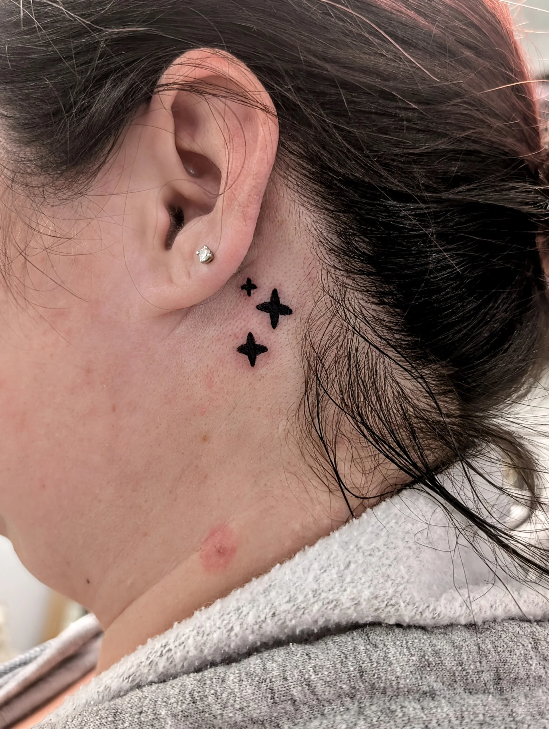Three Stars Behind Ear Alt - illustrative tattoo by Saskatoon tattoo artist