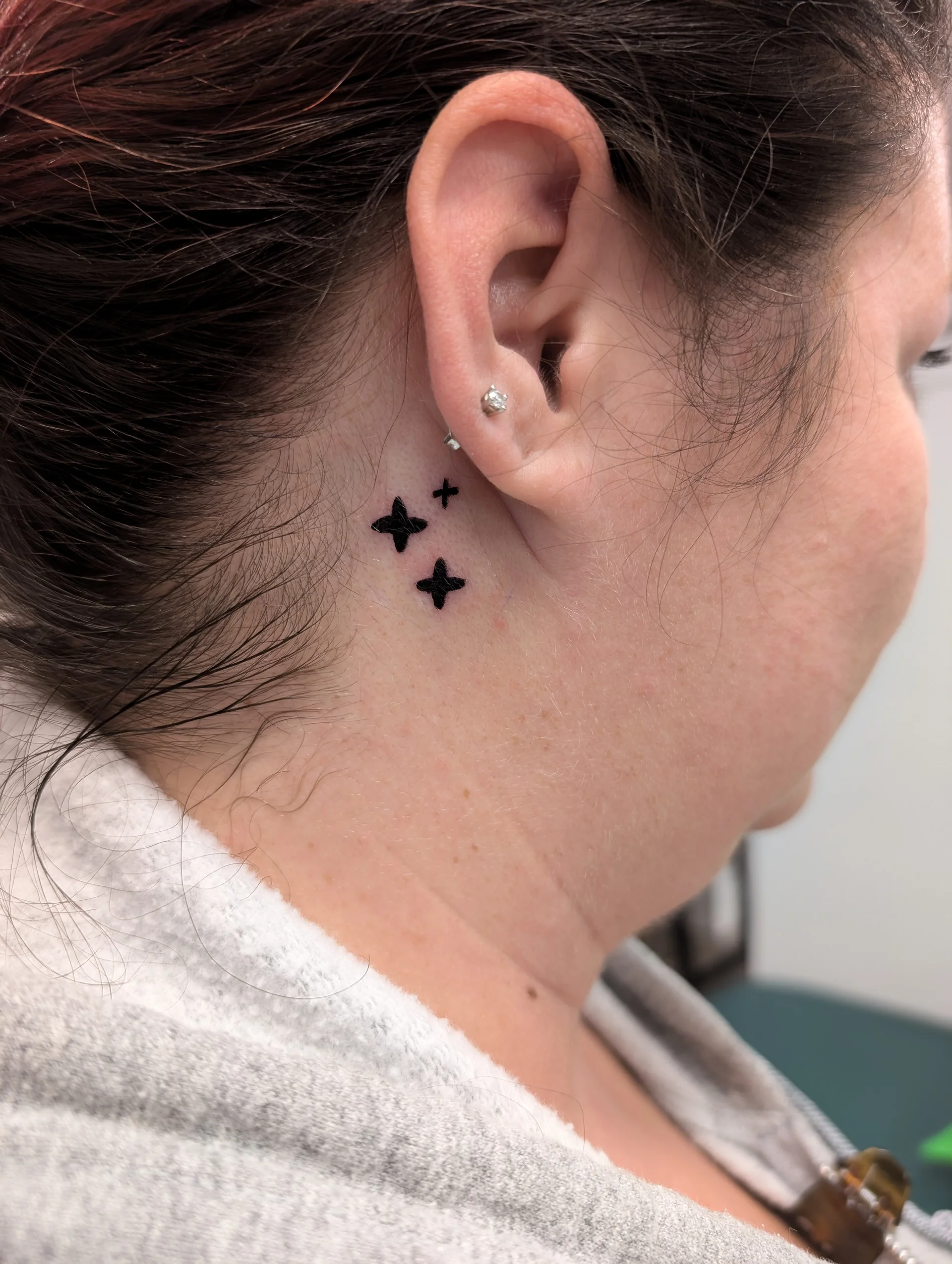 Three Stars Behind Ear - illustrative tattoo by Saskatoon tattoo artist