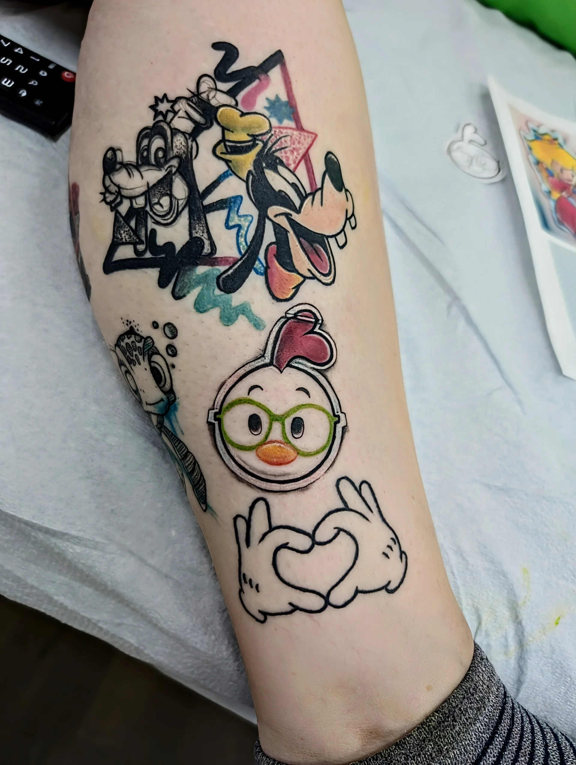 Disney Cartoon Leg Patchwork - new school tattoo by Saskatoon tattoo artist