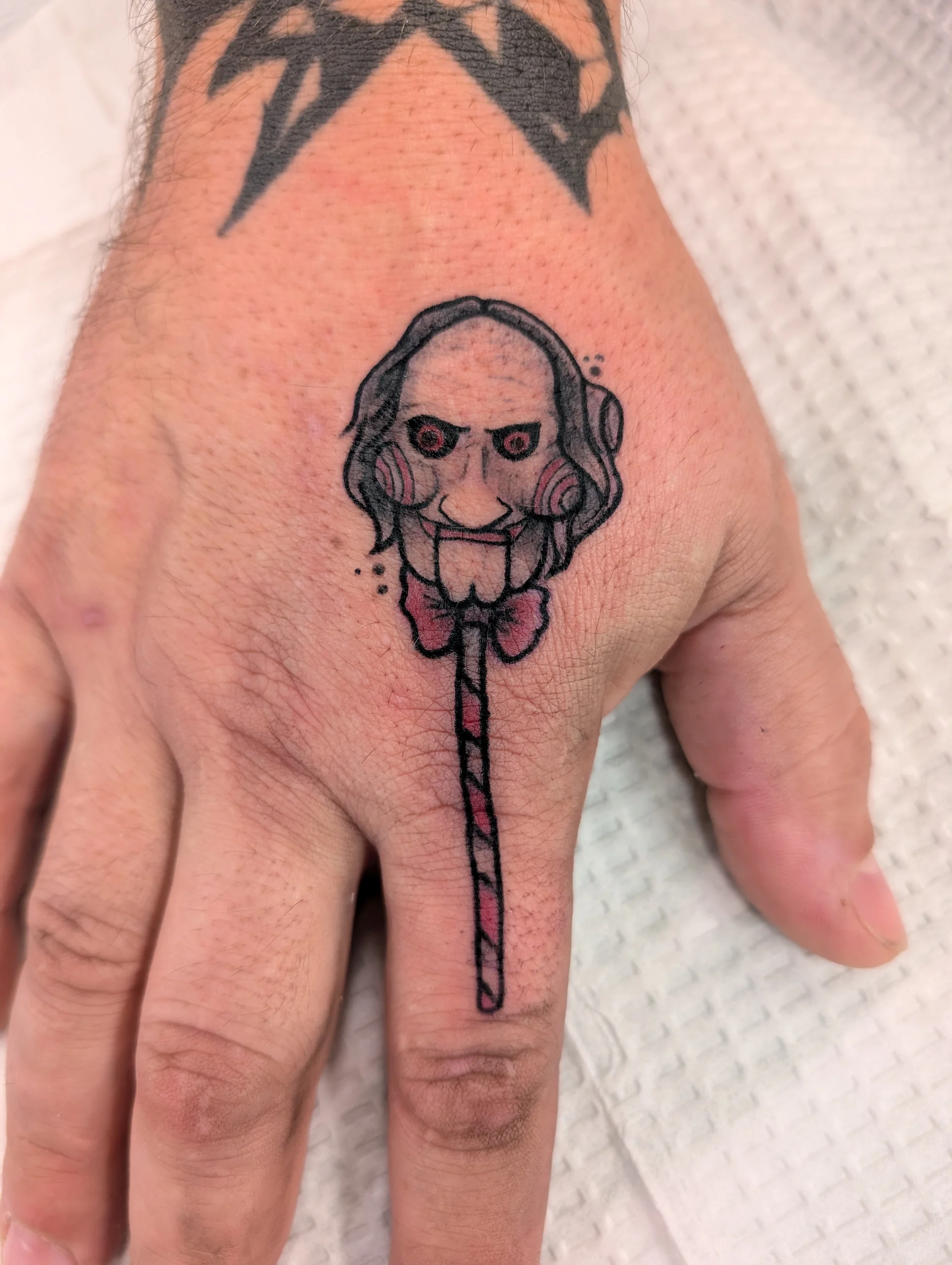 Jigsaw Billy Puppet Skeleton Key Lollipop - new school tattoo by Saskatoon tattoo artist