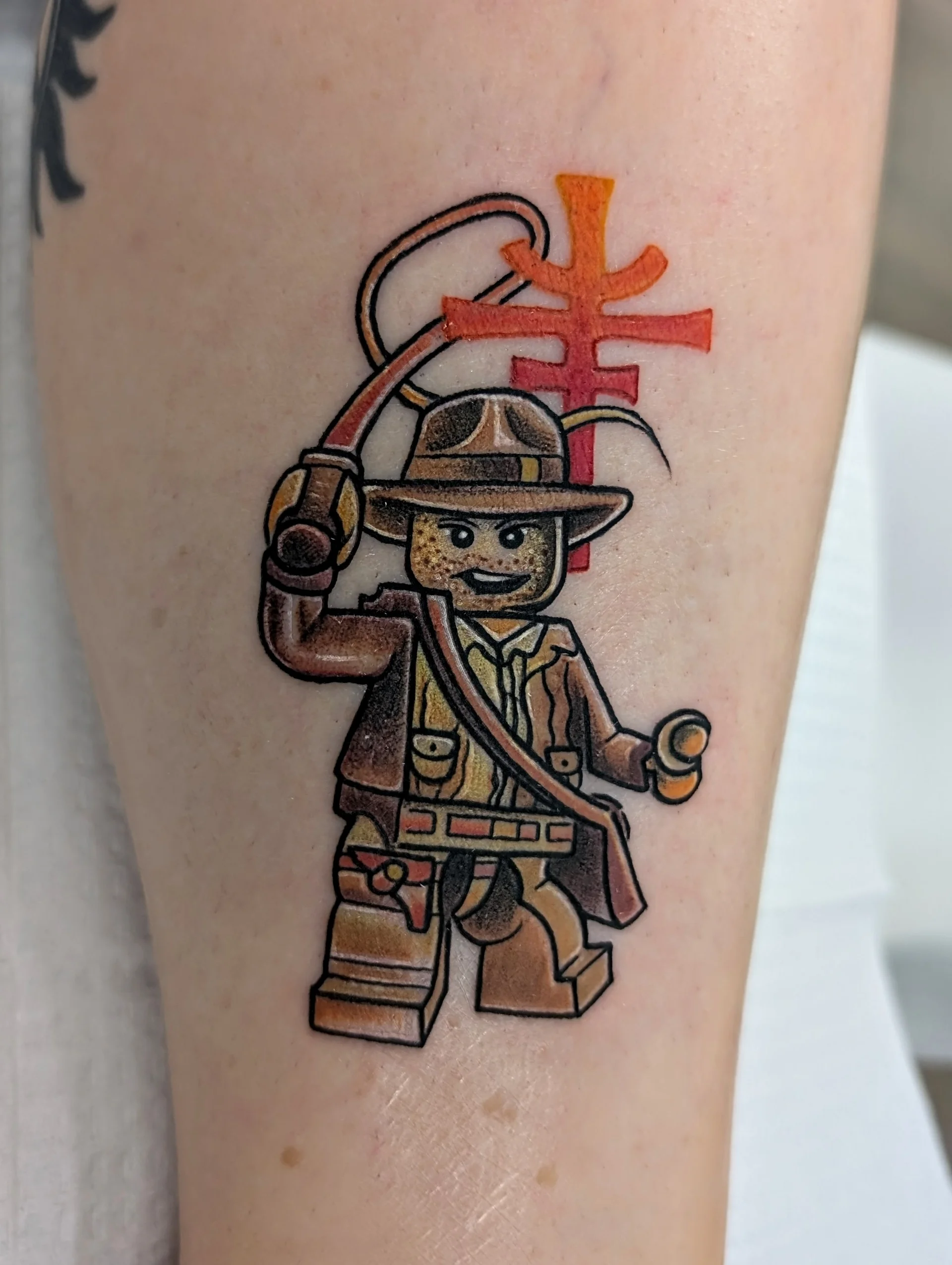 Lego Indiana Jones Whip - new school tattoo by Saskatoon tattoo artist
