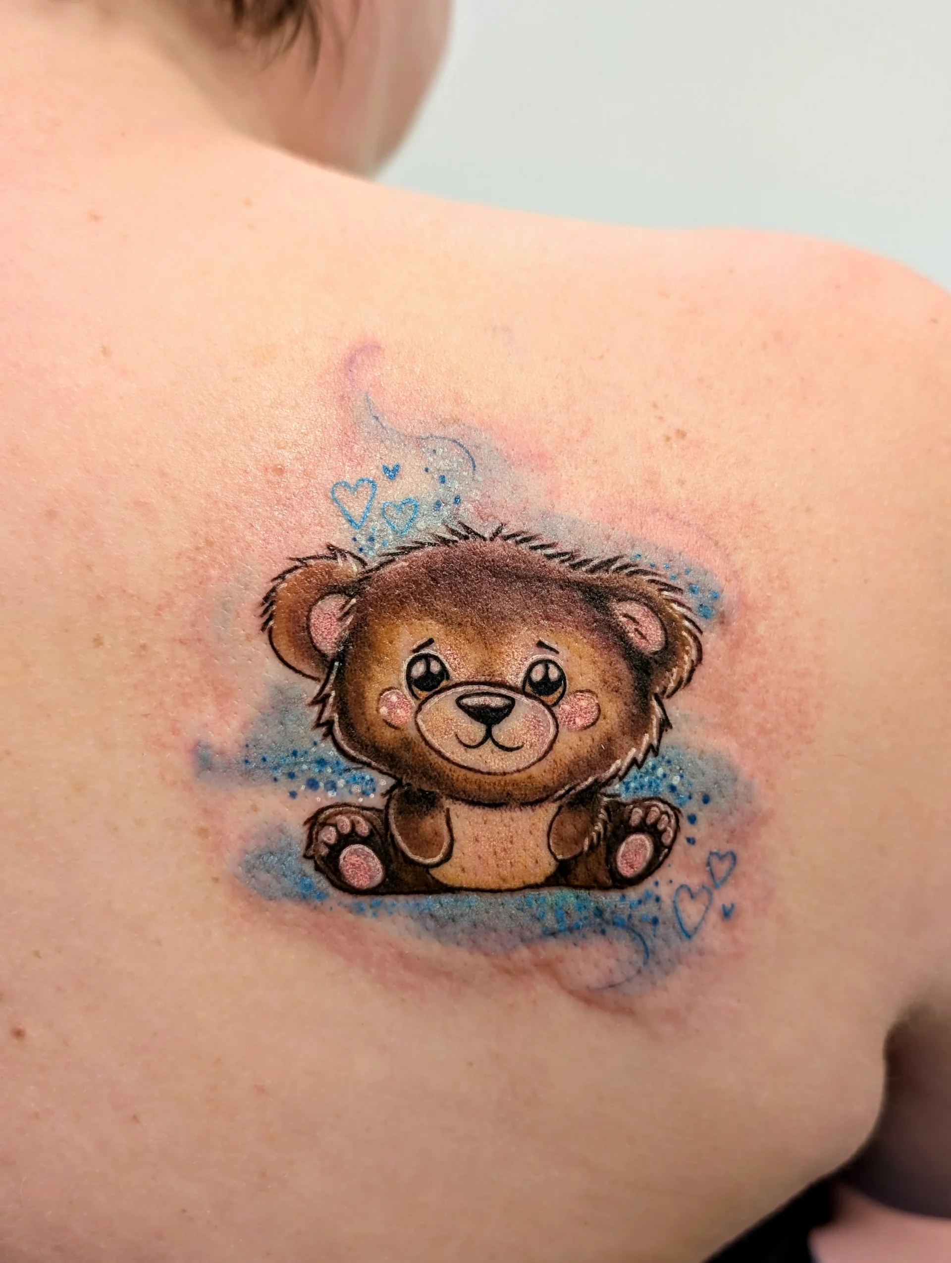Sad Teddy Bear Blue Hearts - new school tattoo by Saskatoon tattoo artist