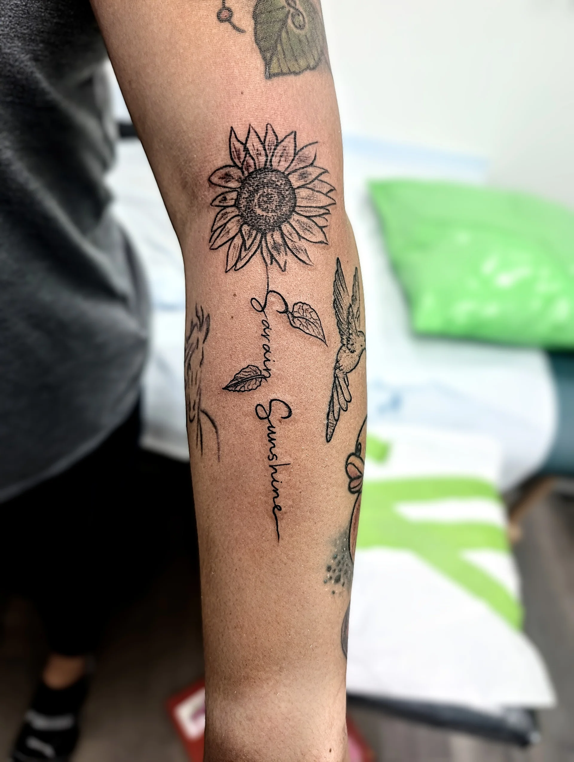 Sunflower Text Stem Forearm - script / lettering tattoo by Saskatoon tattoo artist